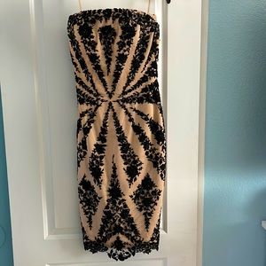 Stunning strapless evening dress. Beige with black lace and beaded overlay.